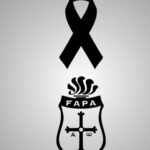 Imagen de un corredor en una prueba de atletismo con un ambiente de tristeza y condolencias
