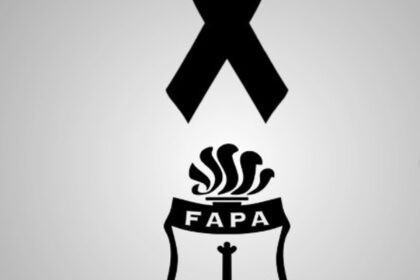 Imagen de un corredor en una prueba de atletismo con un ambiente de tristeza y condolencias